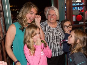 Marianne Wilkinson greets Jenna Sudds as she arrives at Papa Sam's Restaurant on March Rd with her children after winning Ward 4, Kanata North in the municipal election.