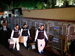 Turkish forensic officers leave the Saudi consulate after they conducted a new search over the disappearance and alleged slaying of writer Jamal Khashoggi, in Istanbul, Oct. 18, 2018.