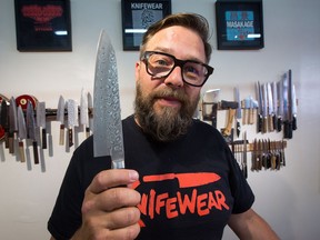Kevin Kent, CEO of Knifewear Group, holds up one of his favourite knives. He wants customers and employees to leave the shop happy.