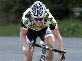 FILE - In this July 30, 2010, file photo Floyd Landis sprints to the finish line after racing a 2.3-mile time trial section during the Tour of the Catskills cycling race in Tannersville, N.Y. Landis is using money he earned by taking down Lance Armstrong to start his own cycling team. The man whose own doping saga cost him the 2006 Tour de France title and eventually helped expose Armstrong's cheating says he's building a developmental team for 2019 that will be based out of Canada.