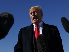 President Donald Trump speaks to media on the tarmac before boarding Air Force One, Thursday, Oct. 18, 2018, in Andrews Air Force Base, Md., en route to speak at a campaign rally in Neptune Aviation Services, Missoula, Mont.