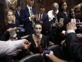 Actress Alyssa Milano talks to the media after she arrived for the Senate Judiciary hearing on Capitol Hill in Washington, Thursday, Sept. 27, 2018. In the year since Milano's 2017 call for survivors of sexual assault and harassment to post on social media, #MeToo has toppled men in the highest echolons of power, and galvanized a wave of activism that has reverberated both online and on the ground.