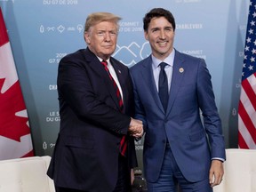 Canada's Prime Minister Justin Trudeau meets with U.S. President Donald Trump at the G7 leaders summit in La Malbaie, Que., on Friday, June 8, 2018. The worst-case scenario was the potential for Trump to turn a simple free trade agreement among sovereign states, in which each country remained free to set its own trade and monetary policies, into a kind of customs and currency union.