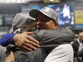 Dodgers manager Dave Roberts, joins in the celebration after the team's victory against the Brewers in Game 7 of the National League Championship Series in Milwaukee on Saturday night.