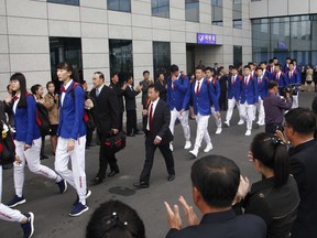 A Chinese sports delegation arrives at the airport in Pyongyang, North Korea, Monday, Oct. 8, 2018.