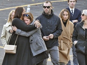 Mourners leave St. Stanislaus Roman Catholic Church during calling hours for Schoharie limo crash victims; Abigail (King) Jackson, Adam "Action" Jackson, Mary (King) Dyson, Robert J. Dyson, Allison A. King, Amy (King) Steenburg, Axel J. Steenburg and Richard Steenburg Jr., on Friday Oct. 12, 2018, in Amsterdam, N.Y.