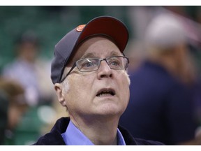 FILE - In this Oct. 12, 2015 file photo, Portland Trail Blazers owner Paul Allen looks on before the start of the first quarter of an NBA preseason basketball game against the Utah Jazz in Salt Lake City. Allen, billionaire owner of the Trail Blazers and the Seattle Seahawks and Microsoft co-founder, died Monday, Oct. 15, 2018 at age 65. Earlier this month Allen said the cancer he was treated for in 2009, non-Hodgkin's lymphoma, had returned.