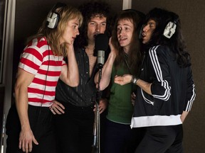 This image released by Twentieth Century Fox shows, from left, Ben Hardy, Gwilym Lee, Joe Mazzello and Rami Malek in a scene from "Bohemian Rhapsody."
