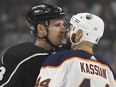 Los Angeles Kings defenceman Dion Phaneuf and the Edmonton Oilers' Zack Kassian face off.