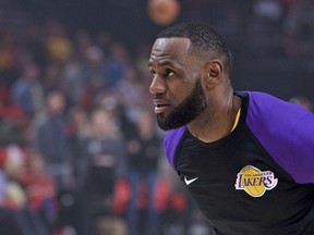 Los Angeles Lakers forward LeBron James partakes in warm ups before an NBA basketball game against the Portland Trail Blazers in Portland, Ore., Thursday, Oct. 18, 2018.