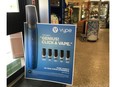 A display board advertises vape pens for sale at an Ottawa convenience store. The devices use e-liquid in a variety of flavours, with or without nicotine.