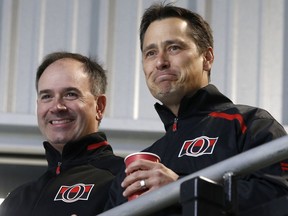 Senators head coach Guy Boucher, right, seen here with GM Pierre Dorion during a mid-September practice, is heading into the final season of his contract, but says he's not worried about that. Tony Caldwell/Postmedia