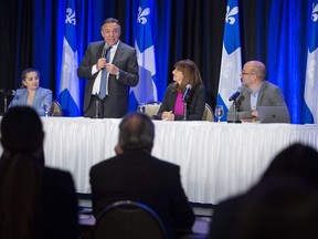 Quebec premier-designate Francois Legault addresses a meeting of his new caucus and defeated candidates in Boucherville, Que., on Wednesday, Oct. 3, 2018.