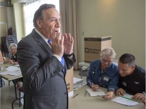 Coalition avenir du Québec leader François Legault arrives to cast his ballot Monday.