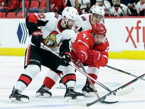 Senators winger Tom Pyatt battles for the puck against the Red Wings' Dylan Larkin during a game last season.