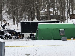 In this March 13, 2018 photo, an FBI tent is seen behind police tape at the base of a hill where investigators were conducting an excavation for Civil War-era gold in Dents Run, Pa. The FBI says the dig came up empty, but treasure hunters believe investigators might have found the legendary gold cache.