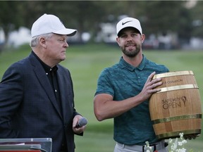 Former tour pro and TV golf analyst Johnny Miller, left, stands beside Kevin Tway after Tway receives the trophy for winning the Safeway Open PGA Tour event on Oct. 7.