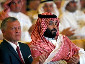 Saudi Crown Prince, Mohammed bin Salman, right, and Jordan's King Abdullah II, applaud at the Future Investment Initiative conference, in Riyadh, Saudi Arabia, Tuesday, Oct. 23.