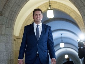 Conservative Leader Andrew Scheer makes his way to speak to media in response to the USMCA trade deal, in the foyer of the House of Commons on Parliament Hill, in Ottawa on Monday, Oct. 1, 2018.