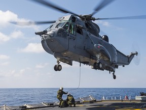In this 2017 photo, crewmembers are shown conducting hoisting exercises with the CH-124 Sea King helicopter onboard Her Majesty’s Canadian Ship (HMCS) ST JOHN’S. Photo: Leading Seaman Ogle Henry.