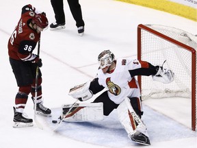 Files: Senators goaltender Mike Condon makes a save.