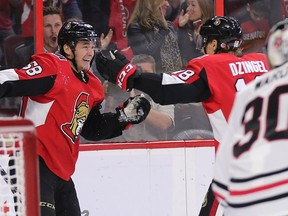 Max Lajoie, left, celebrates his first NHL goal with Ryan Dzingel in the first period of his first NHL game on Thursday, Oct. 4, 2018.