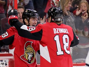 Max Lajoie (left) celebrates his first ever NHL goal with Ryan Dzingel in the first period against the Blackhawks at the Canadian Tire Centre.