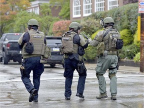 Policce respond to an active shooter situation at the Tree of Life synagogue on Wildins Avenue in the Squirrel Hill neighbourhood of Pittsburgh, Pa., on Saturday, October 27, 2018.