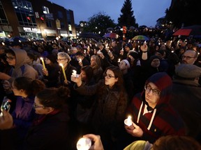 People gather for a vigil in the aftermath of the deadly shooting at the Tree of Life Congregation, in Pittsburgh on Saturday.