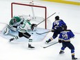 Marc Methot (33) of the Stars tries to clear the puck from the danger zone around the net during a preseason game against the St. Louis Blues on Sept. 28.