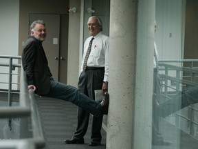 Terence Corcoran, right, chats with then-Editor-in-Chief Doug Kelly in the newspaper's atrium in 2009.