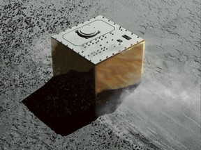 This computer graphic image provided by the Japan Aerospace Exploration Agency (JAXA) shows the Mobile Asteroid Surface Scout, or MASCOT, lander on the asteroid Ryugu. The Japanese unmanned spacecraft Hayabusa2 dropped the German-French observation device, MASCOT, on Wednesday, Oct. 3, 2018, to land on the asteroid as part of a research effort intended to find clues to the origin of the solar system. (JAXA via AP)