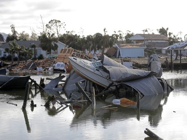 A boat sits amidst debris in the aftermath of Hurricane Michael in Mexico Beach, Fla., Thursday, Oct. 11, 2018.