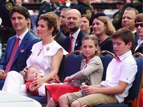 , Prime Minister Justin Trudeau, Sophie Gregoire Trudeau, Hadrien Trudeau, Ella-Grace Trudeau and Xavier Trudeau take part in Canada 150 celebrations on Parliament Hill in Ottawa on July 1, 2017. Prime Minister Justin Trudeau and his family are regularly showered with lavish gifts from dignitaries, but a growing trend among the high-priced offerings are gifts from clothing and accessory designers who use images of the Trudeaus wearing their wares for promotion.