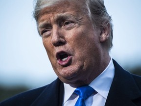 President Donald Trump stops to talk to reporters and members of the media as he walks from the Oval Office on Oct. 26, 2018 in Washington.