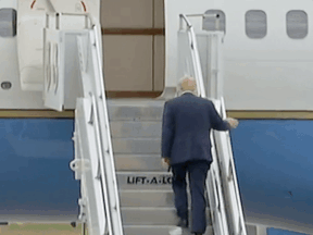 POTUS Donald Trump, with toilet paper in tow, climbing up the stairs to Air Force One.