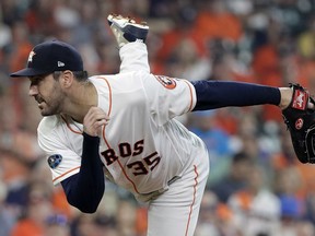 Houston Astros starting pitcher Justin Verlander (35) delivers a pitch against the Cleveland Indians during the first inning in Game 1 of an American League Division Series baseball game Friday, Oct. 5, 2018, in Houston.
