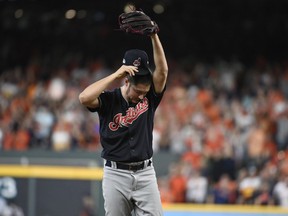 Cleveland Indians Trevor Bauer reacts after giving up a solo home run to Houston Astros' Alex Bregman during the seventh inning of Game 2 of a baseball American League Division Series, Saturday, Oct. 6, 2018, in Houston.