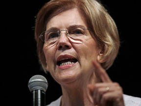 In this Wednesday, Aug. 8, 2018, file photo, U.S. Sen. Elizabeth Warren, D-Mass., speaks during a town hall-style gathering in Woburn, Ma.