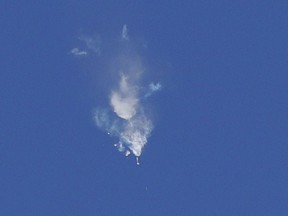 Smoke rise as the boosters of first stage of the Soyuz-FG rocket with Soyuz MS-10 space ship carrying a new crew to the International Space Station, ISS, separate after the launch at the Russian leased Baikonur cosmodrome, Kazakhstan, Thursday, Oct. 11, 2018. The Russian rocket carries U.S. astronaut Nick Hague and Russian cosmonaut Alexey Ovchinin. The two astronauts are making an emergency landing after a Russian booster rocket carrying them into orbit to the International Space Station has failed after launch.