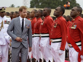 Britain's Prince Harry inspects a guard of honour at his official welcome ceremony in Suva, Fiji, Tuesday, Oct. 23, 2018. Prince Harry and his wife Meghan are on day eight of their 16-day tour of Australia and the South Pacific.