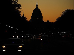 The sun begins to rise behind the U.S. Capitol a day after Americans voted in the midterm elections, on November 7, 2018 in Washington, DC. Democrats have won control of the  House of Representatives while the U.S. Senate remains in Republican control.