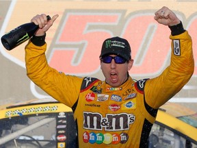 Kyle Busch, driver of the #18 M&M's Toyota, celebrates in Victory Lane after winning the Monster Energy NASCAR Cup Series Can-Am 500 at ISM Raceway on November 11, 2018 in Phoenix, Arizona.