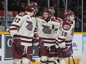 Adam Timleck #18 of the Peterborough Petes celebrates his 3rd goal of the game against the Owen Sound Attack in an OHL game at the Peterborough Memorial Centre on November 15, 2018 in Peterborough, Ontario, Canada.