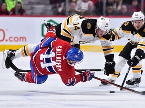 MONTREAL, QC - NOVEMBER 24:  Chris Wagner #14 of the Boston Bruins collides with Brendan Gallagher #11 of the Montreal Canadiens during the NHL game at the Bell Centre on November 24, 2018 in Montreal, Quebec, Canada.