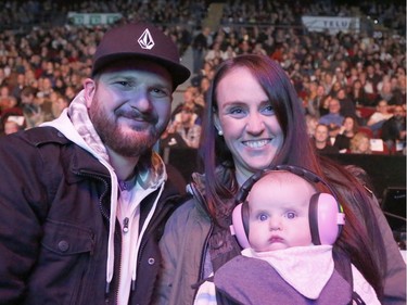 Steve Tozzi, Kristy Tozzi and baby Sofia Tozzi watch the "After the Storm" concert at TD Place arena on Saturday night.