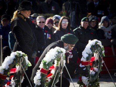Minister of National Defence Minister Harjit Sajjan and Sophie Gregoire-Trudeau place a wreath during Remembrance Day ceremonies at the National War Memorial in Ottawa on Sunday, Nov. 11, 2018.