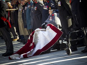 Second World War Veteran Fred Arsenault (98-years-old), takes part in the Remembrance Day ceremony at the National War Memorial in Ottawa on Sunday, November 11, 2018.