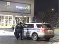Police at the scene of a shooting at the South Keys Shopping Centre on Friday evening.   Patrick Doyle/Postmedia