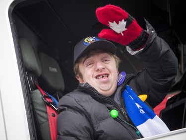 Tysen Lefebvre was waving to the crowd from the fire truck at the very beginning of the 49th Annual Help Santa Toy Parade Saturday, November 17, 2018.  Ashley Fraser/Postmedia